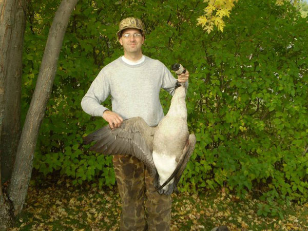 Troy with a goose harvested while hunting with his family in Benton County